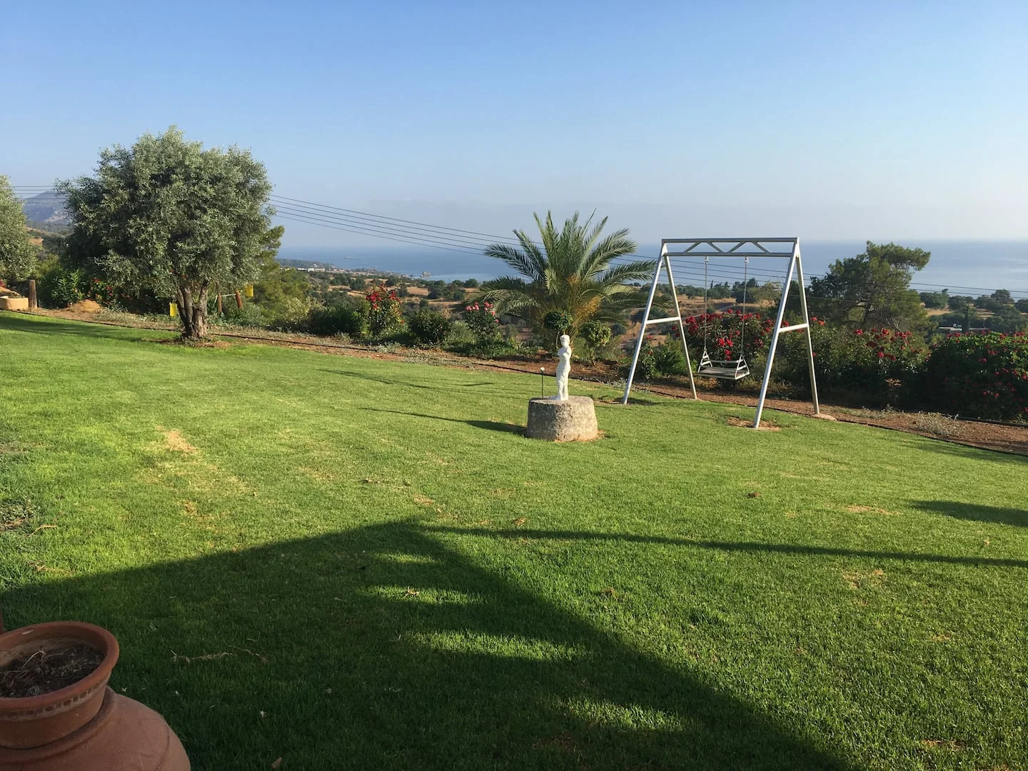 Palms and the sea beyond the Ayia Zoni gardens