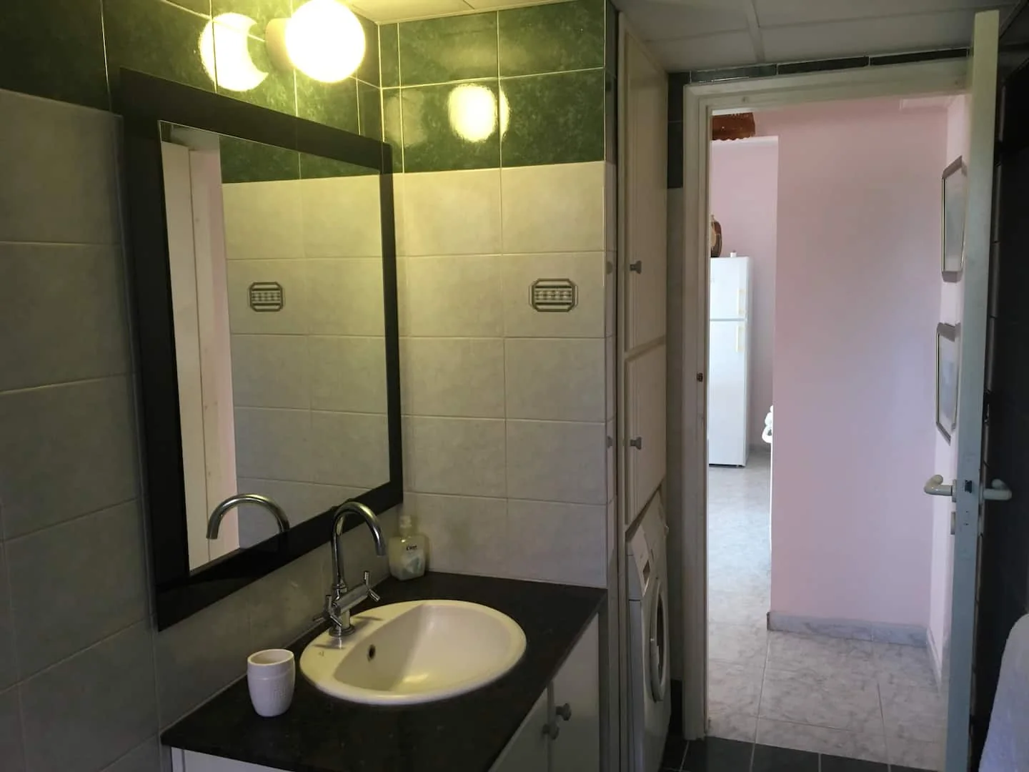 Bathroom basin, mirror and washing machine